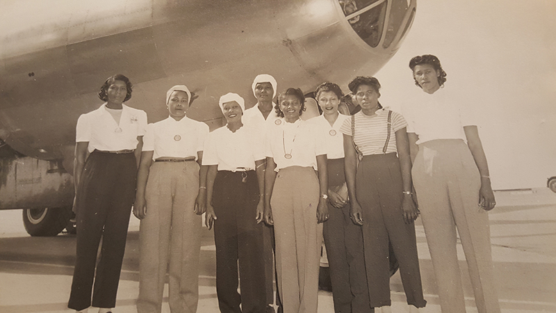 Ms. Althea Skelton, center, and women who worked on the B-29 Bomber at Boeing during World War II.