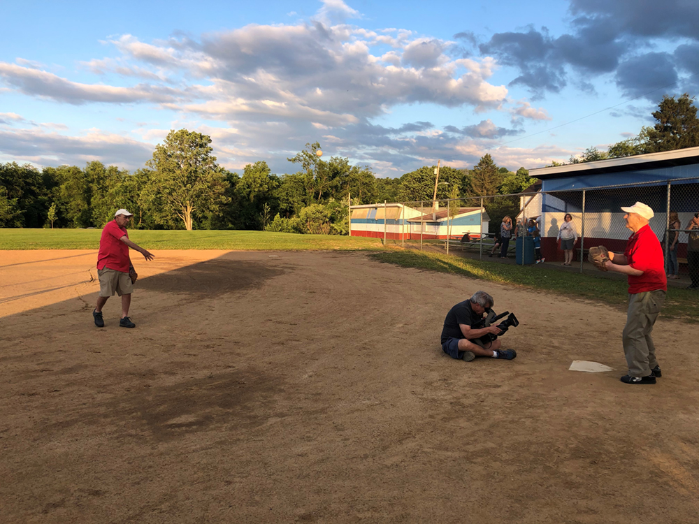 Tom DeRosa and Pete Hoosac, members of the 1952 Little League team, have a catch at Mounds Field in Monongahela.