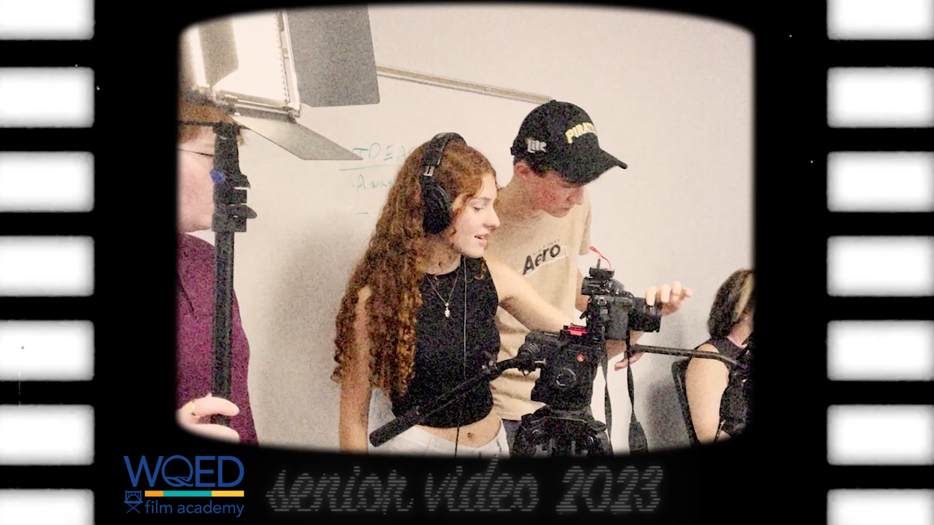 Senior Video Title card with two students making a movie
